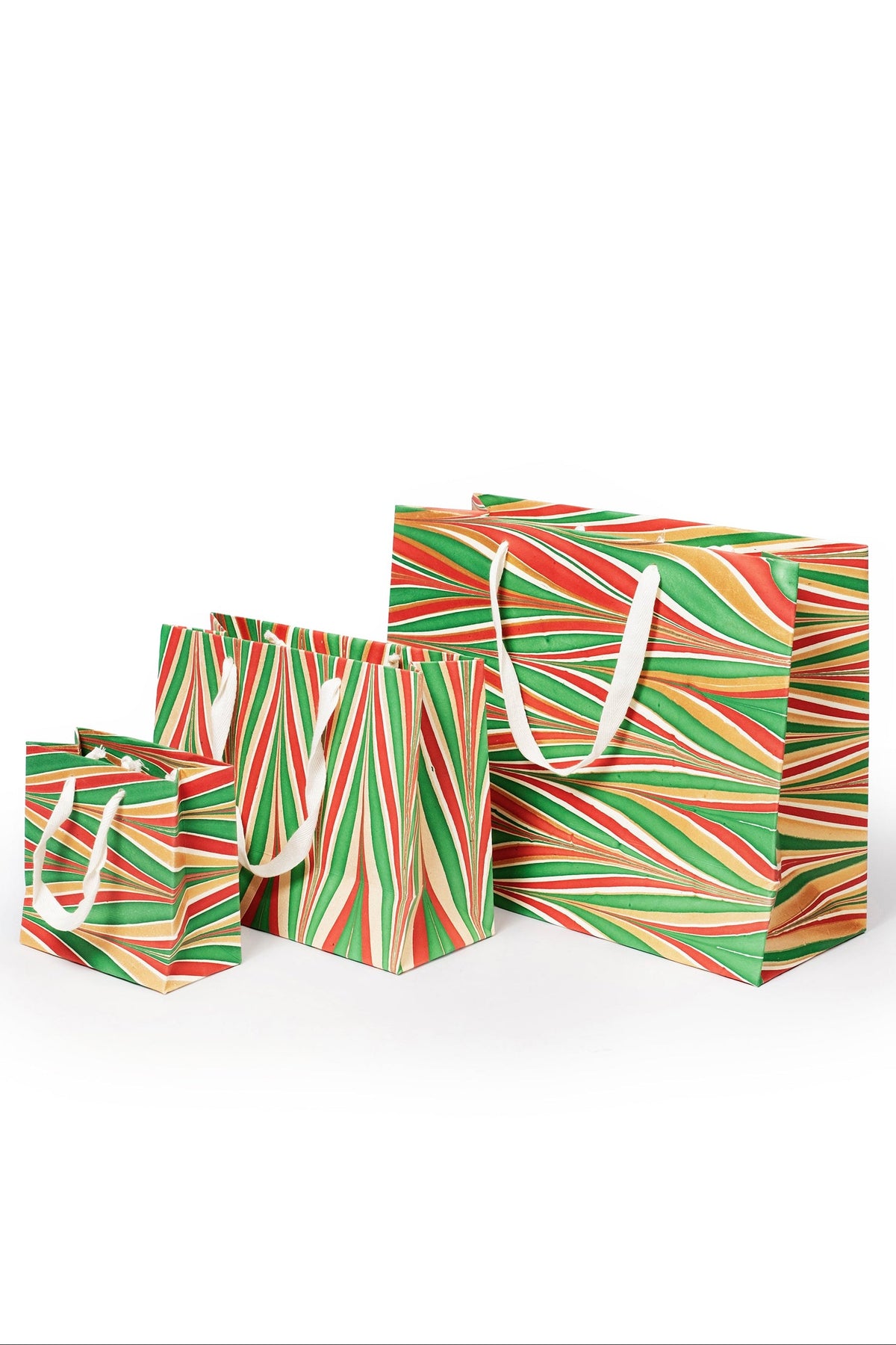 Group of gilded holiday hand marbled gift bags with white handles
