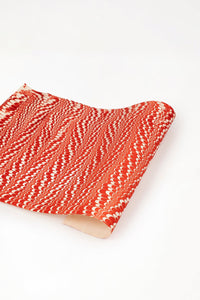 Red and white hand marbled candy cane swirl gift wrapping paper sheet