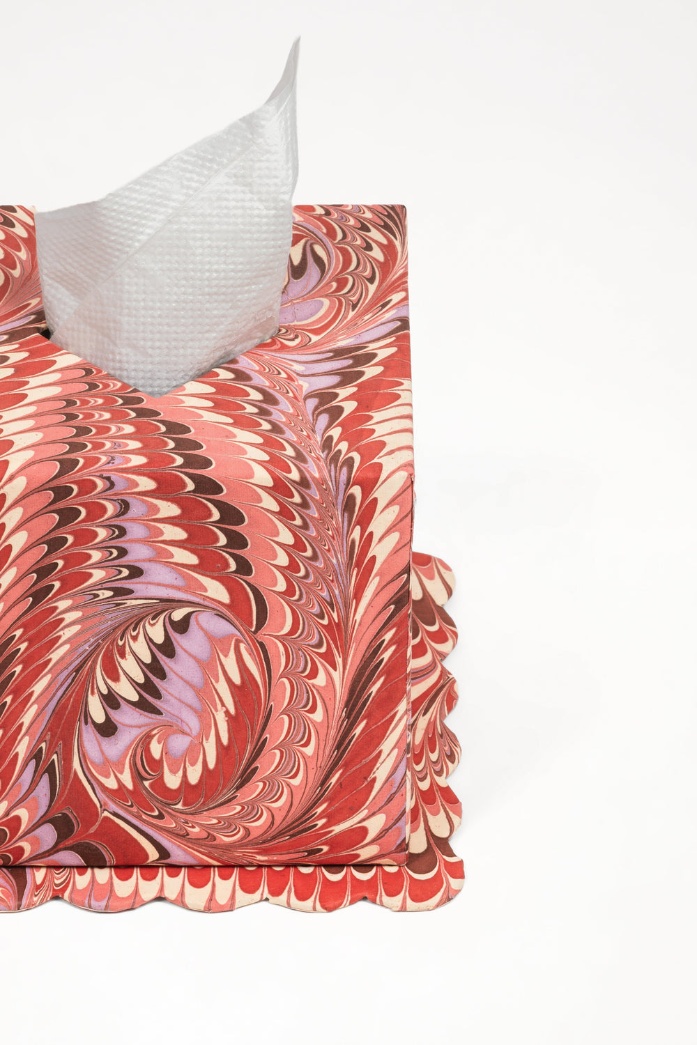 Hand-marbled Florentine pink scallop edge tissue box cover with tissues pulled out