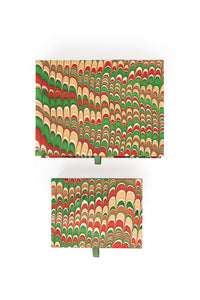 Inner Child hand-marbled keepsake box set in holiday jingle - two rectangular boxes shown from top view with festive marbling designs