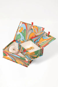 Vibrant multicolor hand-marbled keepsake box set with red ribbon closures
