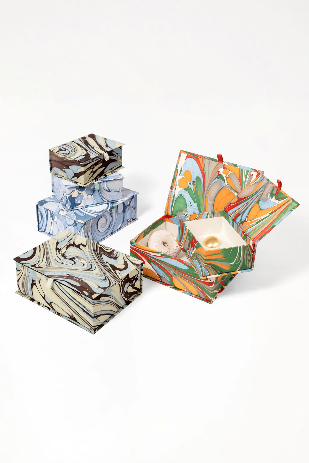 Collection of hand-marbled keepsake boxes in diverse color schemes