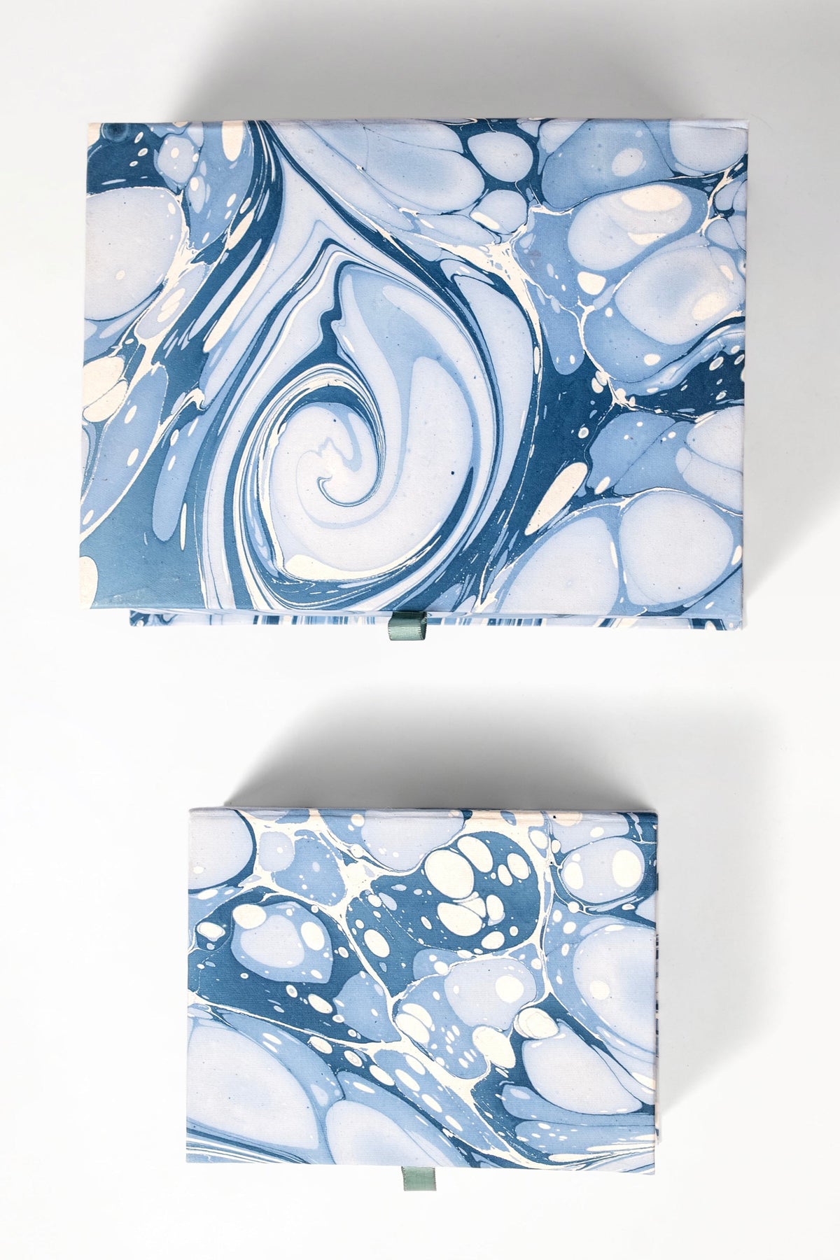 Closed blue ocean wave-patterned keepsake boxes displayed