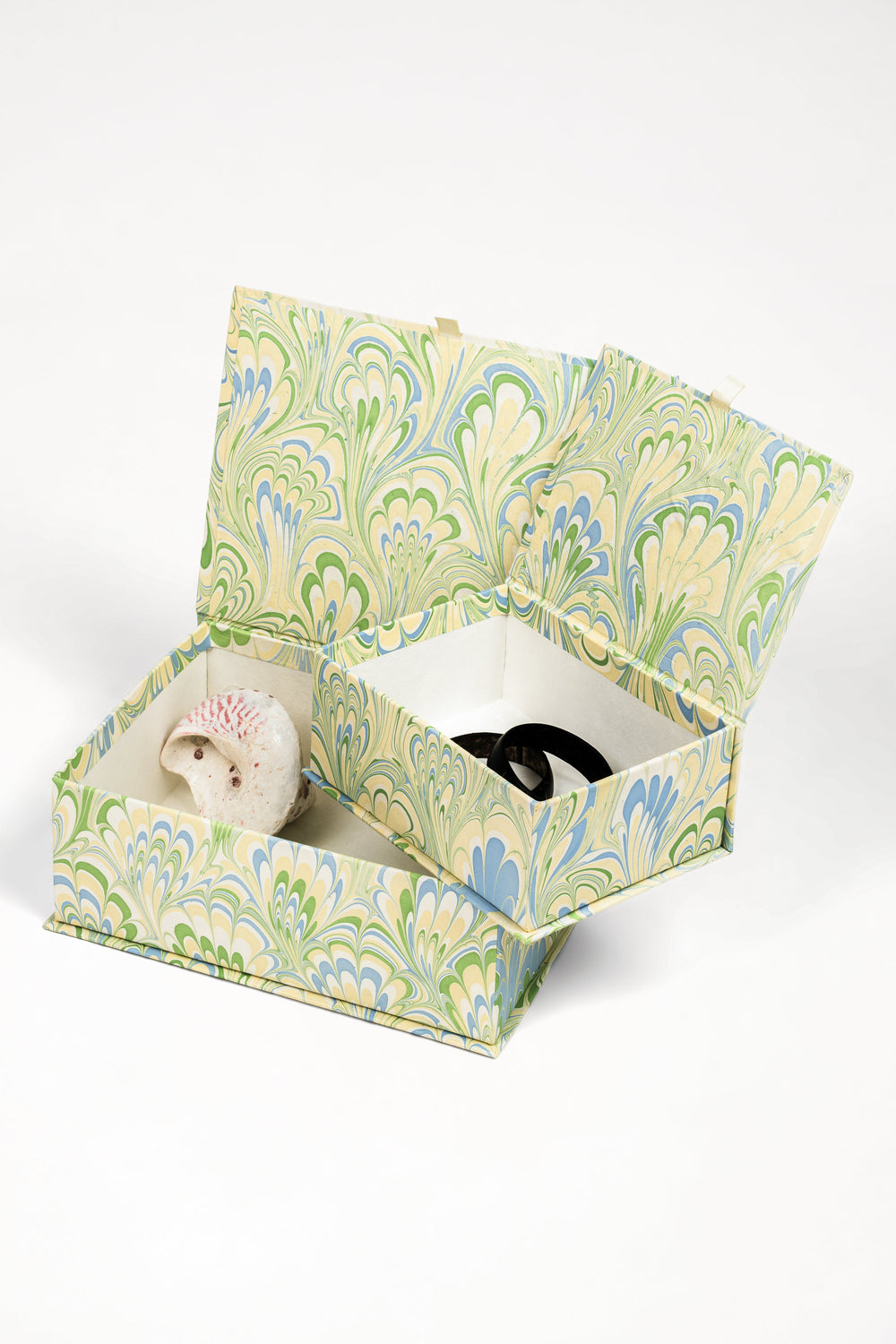 Inner Child hand-marbled storage box open with decorative items inside