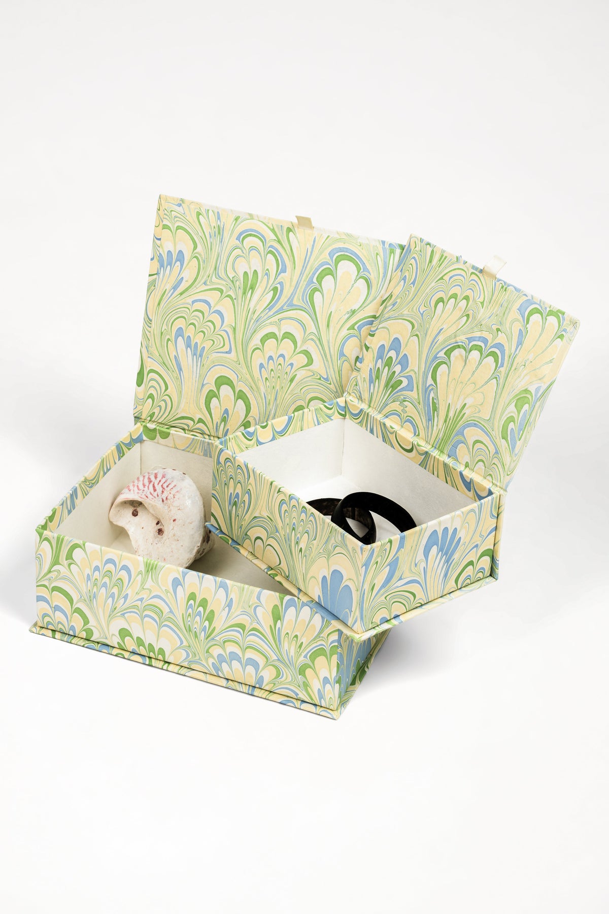 Inner Child hand-marbled storage box open with decorative items inside