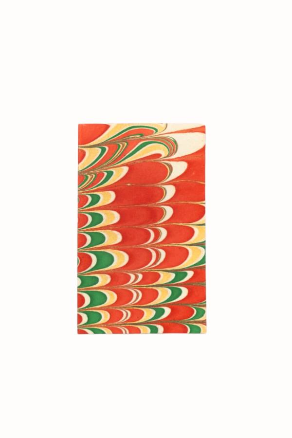 Close-up of hand-marbled notecard with red green yellow swirling patterns - Inner Child