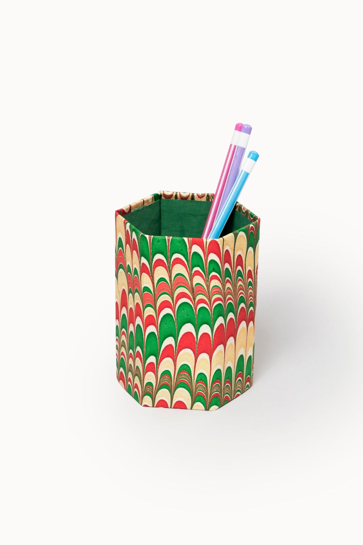 Hexagonal hand-marbled pencil holder with red/green/beige patterns, pink/blue pens - Inner Child