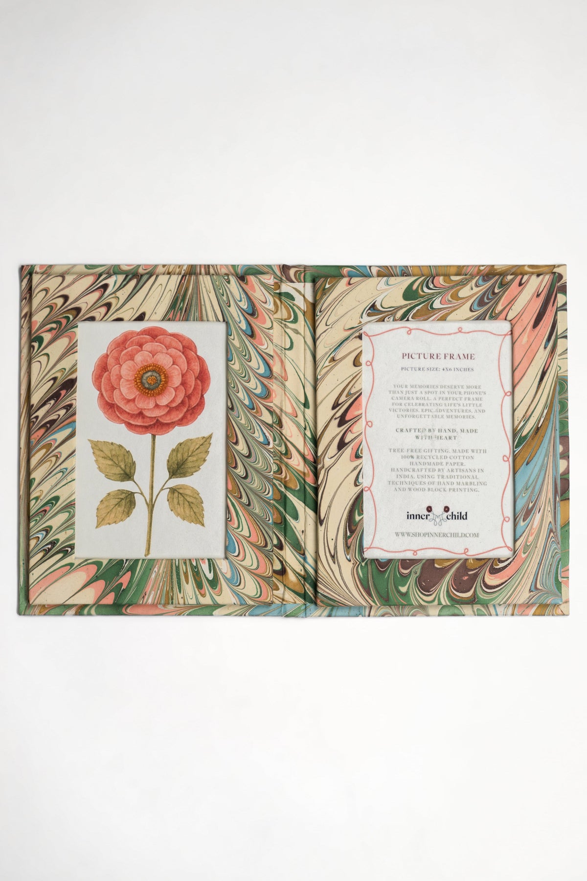 Closed hand-marbled folding picture frame book from Inner Child with flower illustration