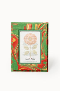 Hand-marbled 4x6 picture frame in Holiday Wave pattern with green, red, gold swirls