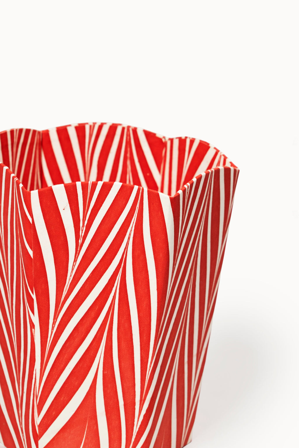 Hand-marbled scallop waste bin in Candy Cane pattern with red and white stripes