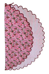 Reversible Holiday Arch Stripes scallop-edged tree skirt with pink floral front
