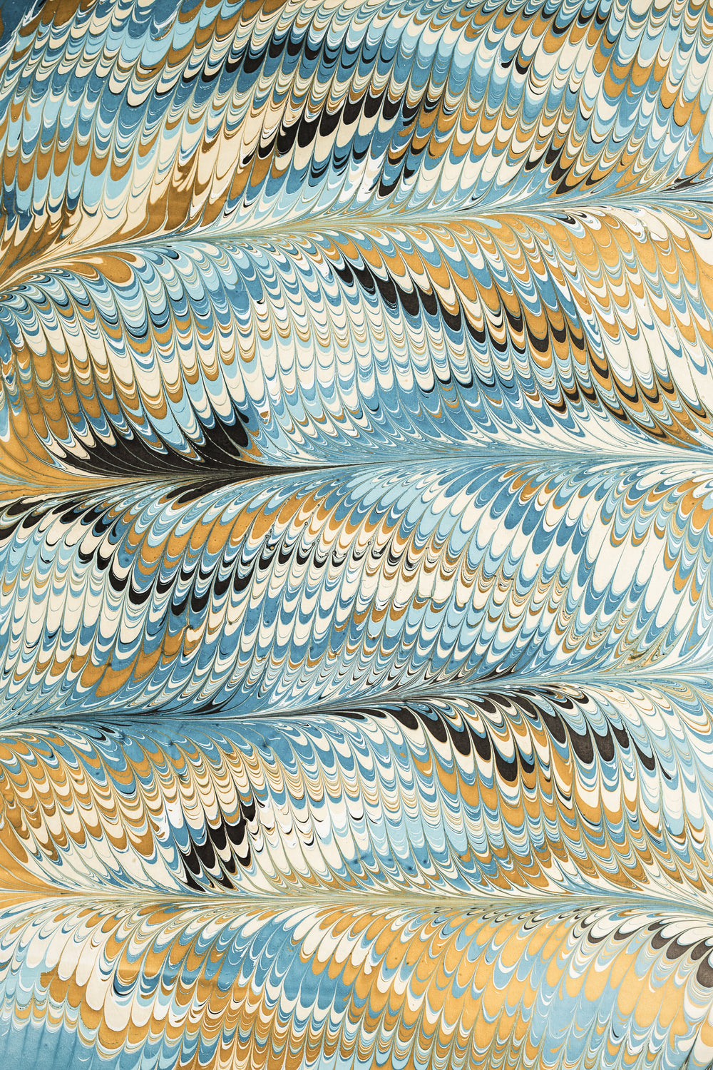 Detailed hand-marbled blue-gold-black pattern from Inner Child