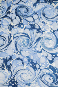 Detailed hand-marbled blue ocean wave pattern with swirls and bubbles