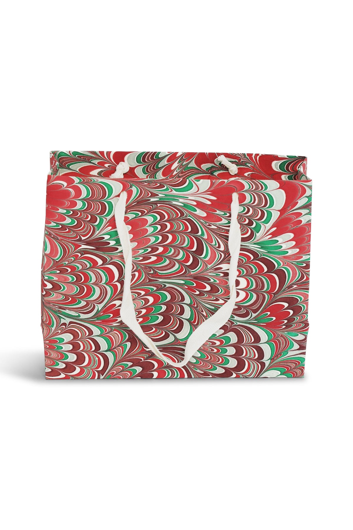 Holiday festive hand marbled medium gift bag with red, green, and white swirl patterns, white handles