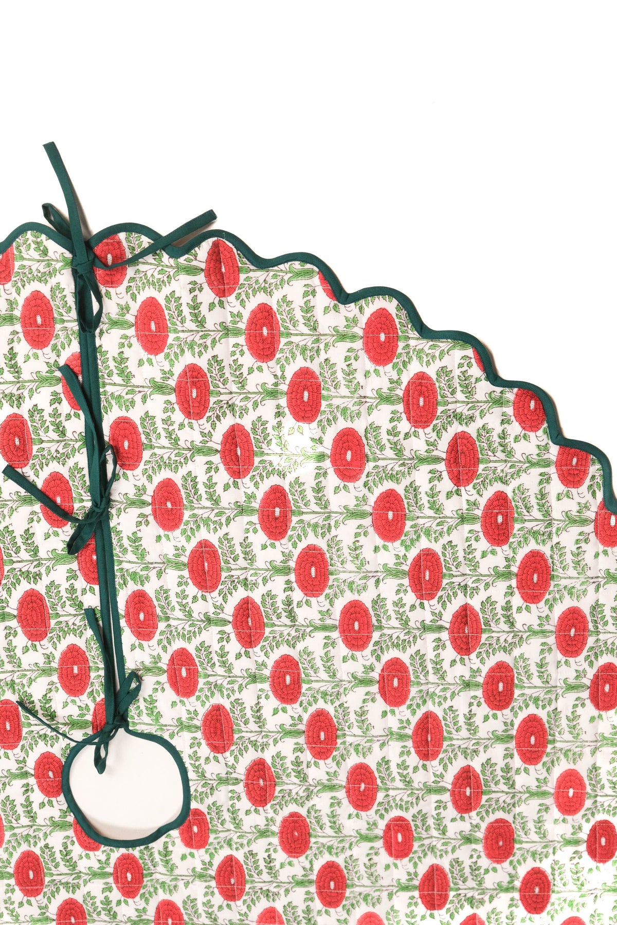 Scallop blockprint quilted tree skirt with red floral pattern, green foliage, Araminta Green