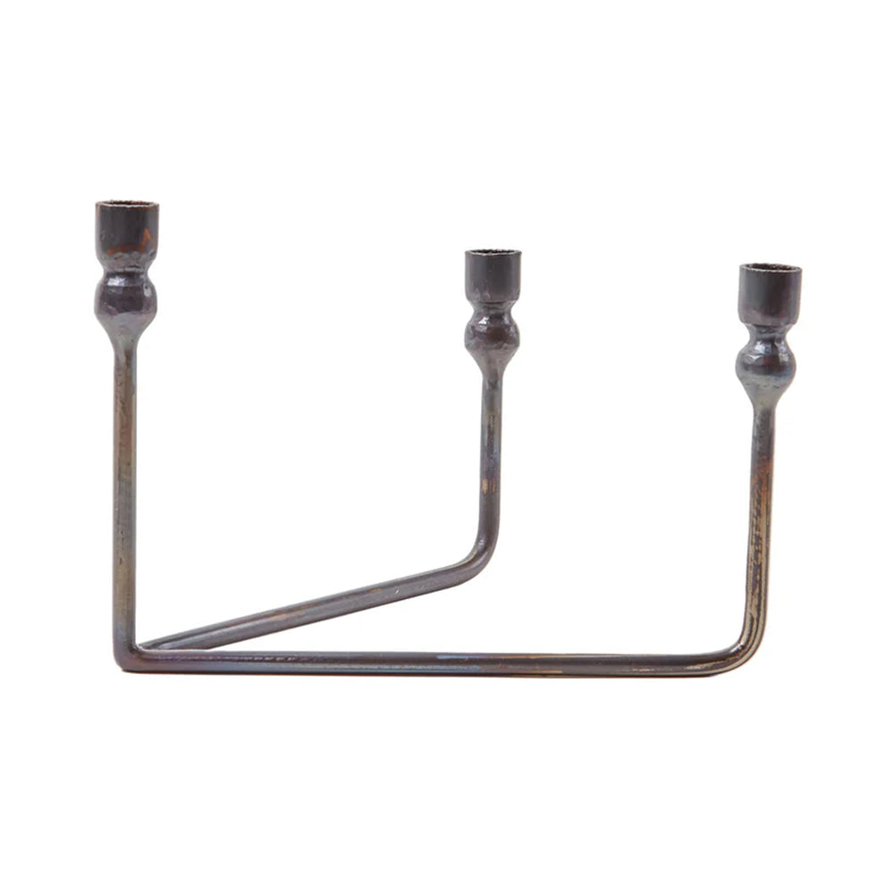 Front view of Urbino iron candelabra showing three tiered arms at varied heights and hand-forged blackened finish on white background