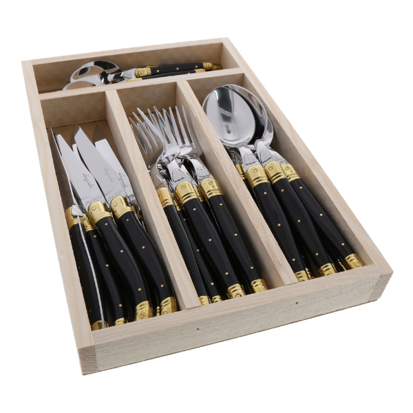Angled view of Everyday Flatware Set in Black & Brass, Set of 24 showcasing black handles with brass detailing in a divided wooden tray