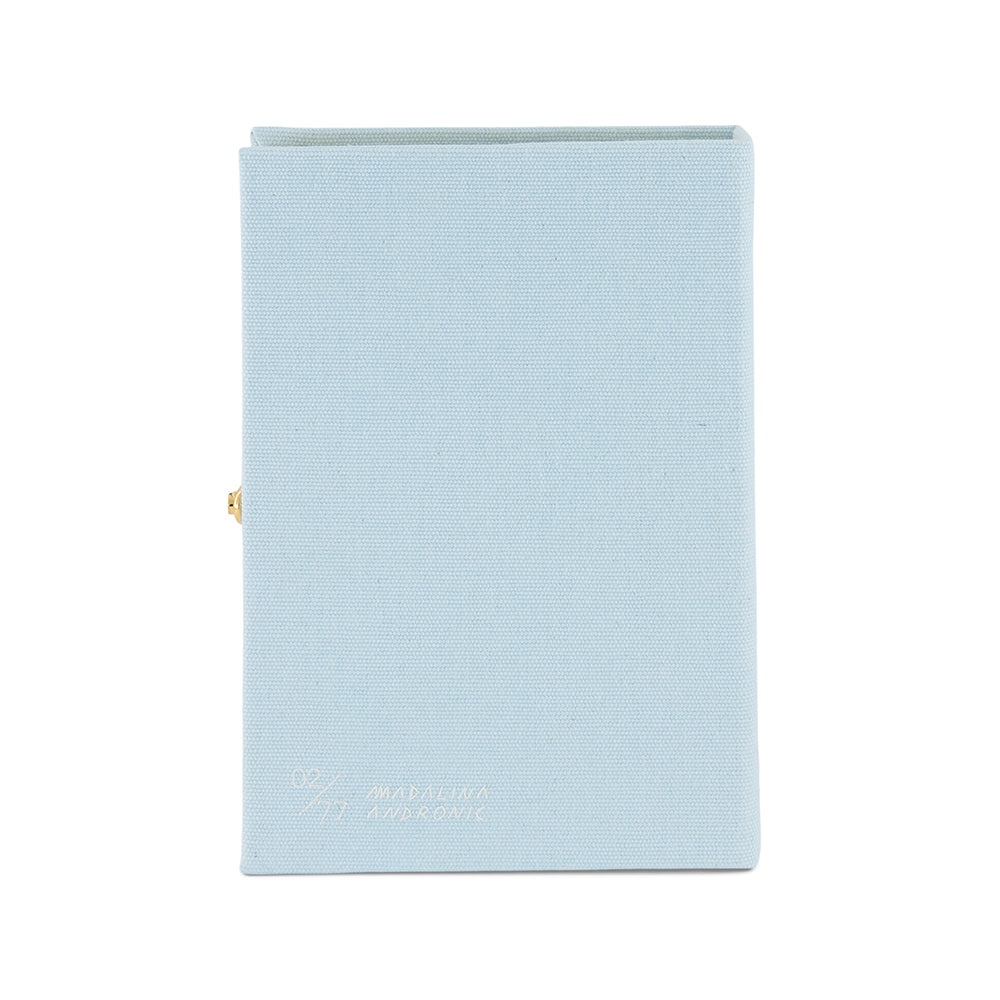 Back view of Greek Love Story book clutch with pale blue canvas cover, gold side clasp, and gold embossing