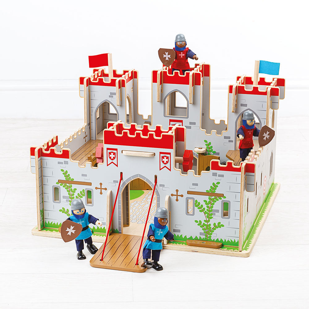 Front view of King George’s wooden castle toy showcasing a working drawbridge, balconies, and knight figures on a white background