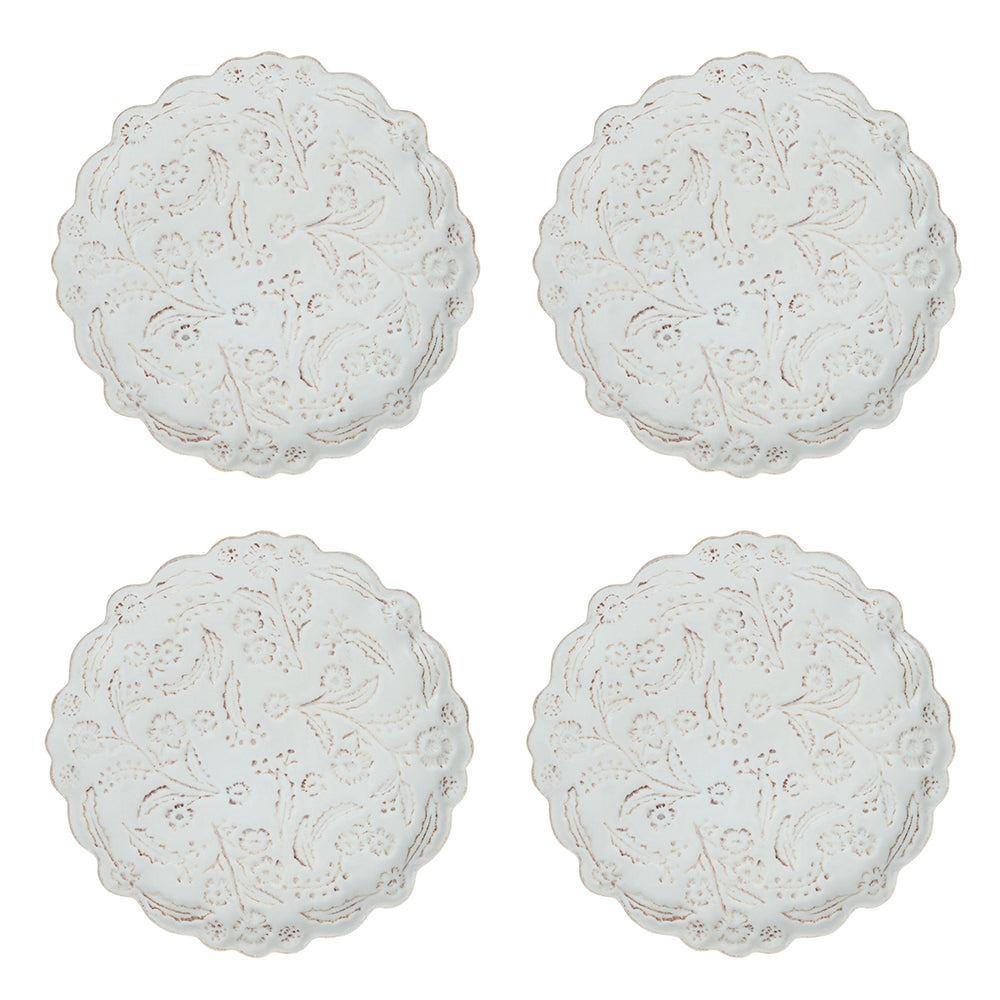 Front view of four Berry & Thread Thistle Cocktail Plates in Whitewash with scalloped edges and textured thistle motif