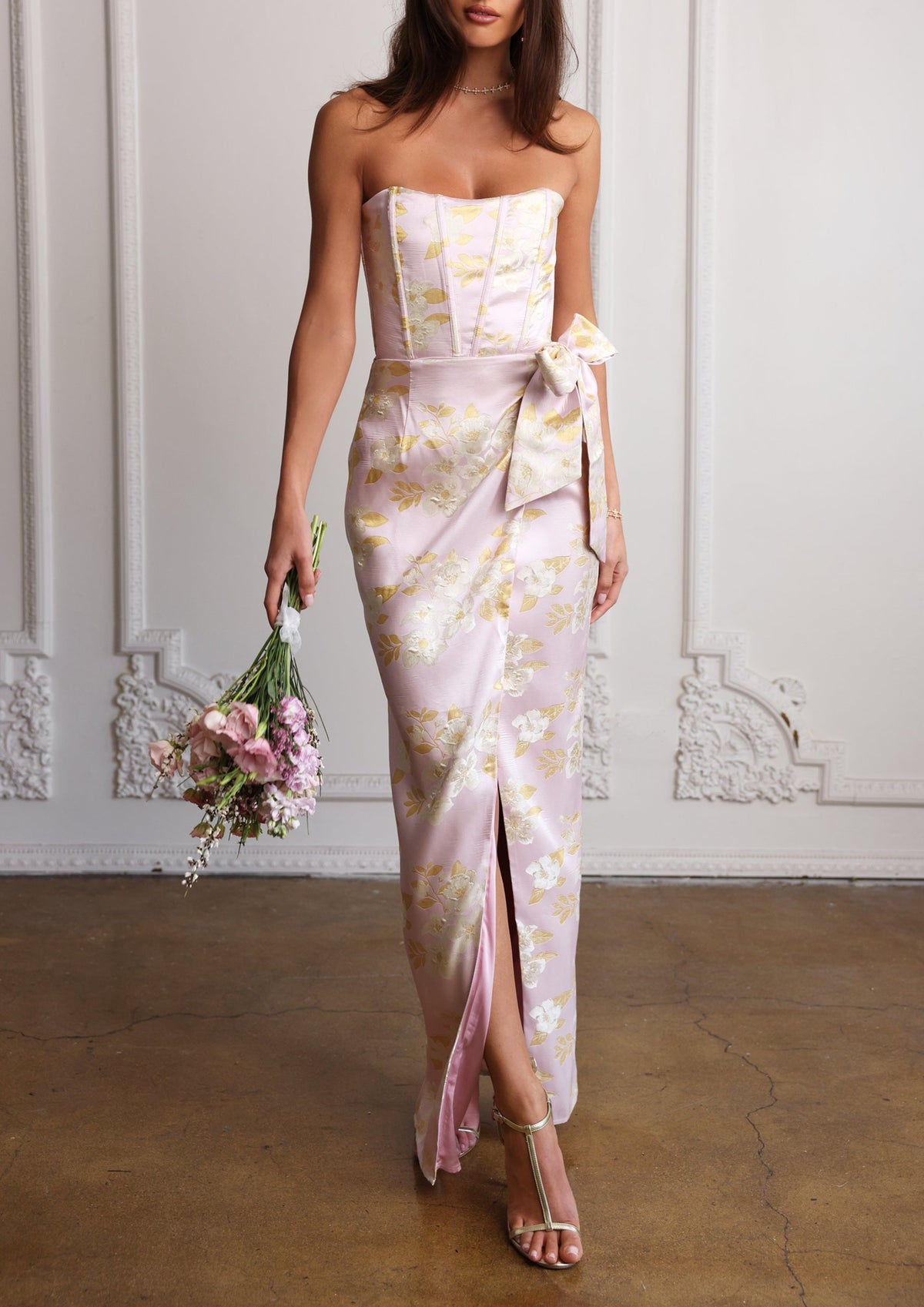 Front view of The June Dress in Light Lilac Baroque Floral showcasing strapless bodice, floral brocade, bow, and front slit