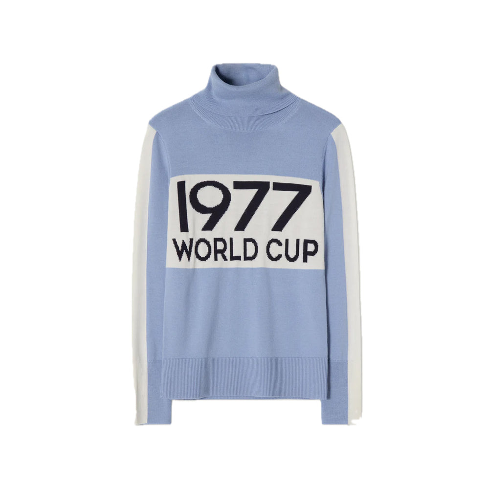Front view of World Cup sweater in light blue with turtleneck, large 1977 WORLD CUP chest text and white contrast sleeve stripes on white background