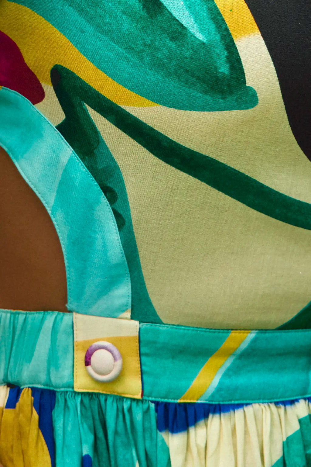 Midi dress in colorful print including pink, green, pink and black with side bodice cut-outs