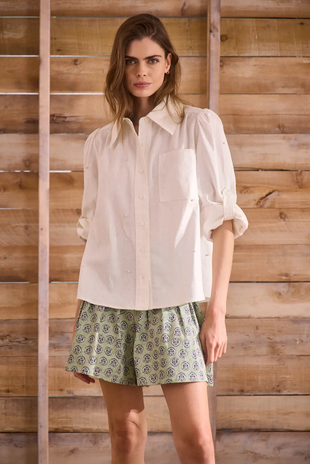 Stretch sateen pleated shorts with a banded waist in Navy Bird Block print.