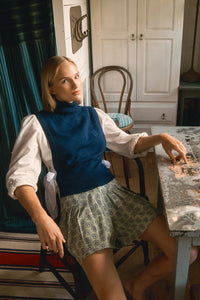 Stretch sateen pleated shorts with a banded waist in Navy Bird Block print.