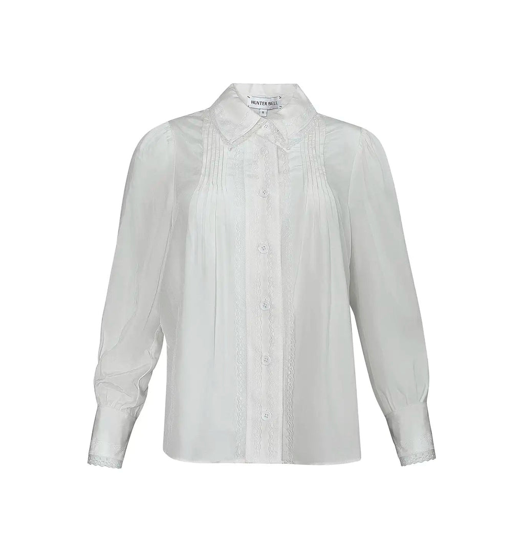 Front view of James Shirt in Ivory showcasing its collared button front, long sleeves, pintuck and lace details on white