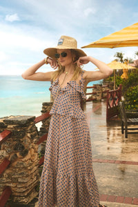 The Jamison Dress in Berryvine paired with HB x Freya straw hat.