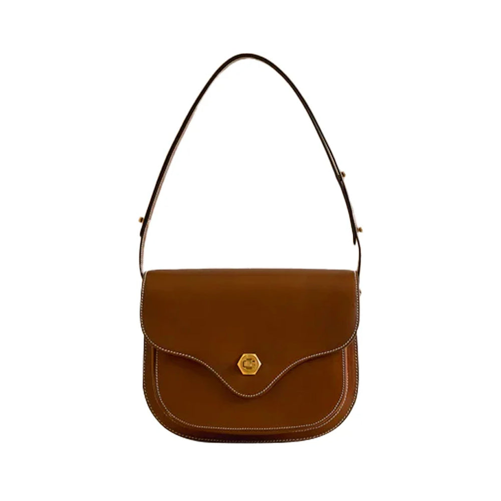 Front view of Jane Vacchetta shoulder bag in Acorn showcasing curved flap, contrast stitching and hexagonal gold clasp on white background
