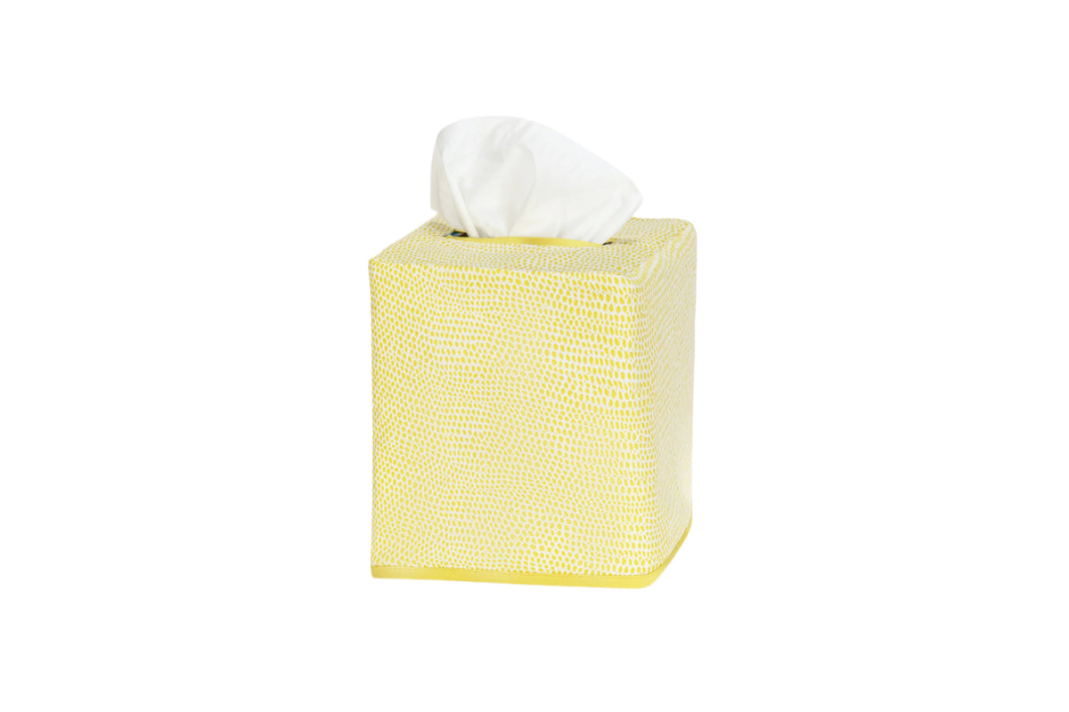 Three-quarter view of Jasper tissue box cover in lemon showing shagreen-inspired print and a tissue on a white background