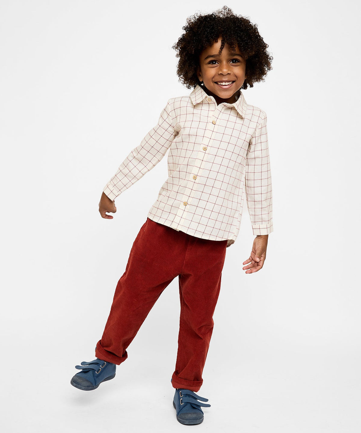 Front view of Jeffie Shirt in Pomegranate Plaid showing Peter Pan collar and true to size fit on child model against white background
