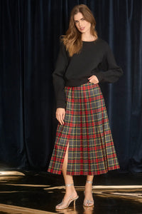 The Dominic Skirt has a banded waist and a straight pleated silhouette finished with front slits. 