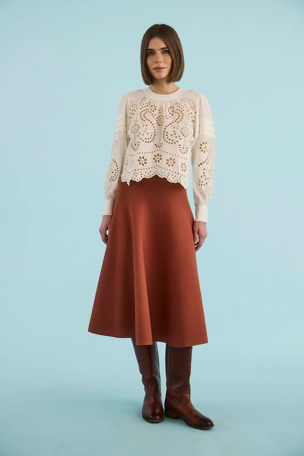 The Jennifer Top in Ivory paired with the Joan Skirt in Rust. 