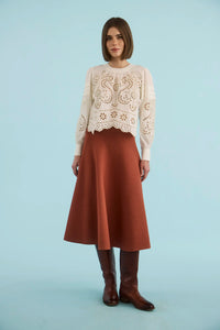 The Jennifer Top in Ivory paired with the Joan Skirt in Rust. 