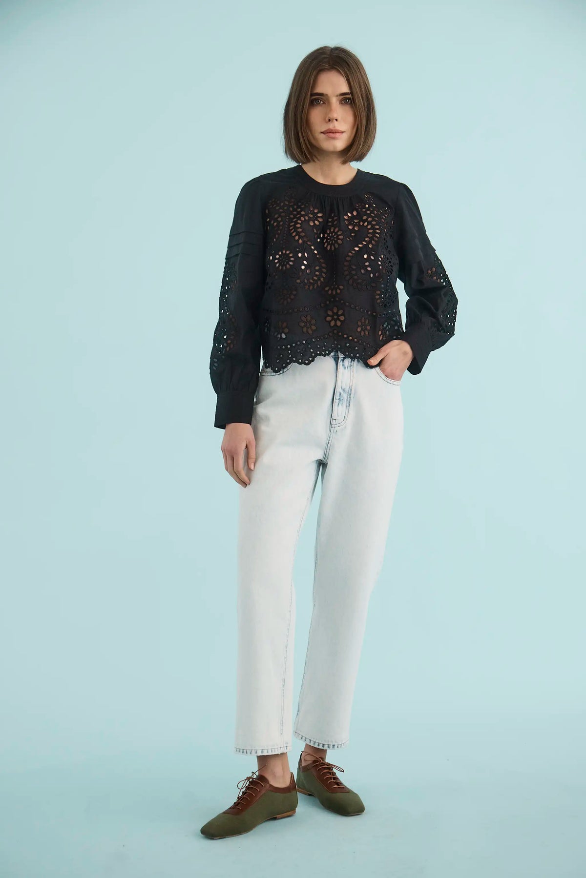 The Jennifer Top in Onyx paired with the Wray Pant in washed blue denim. 