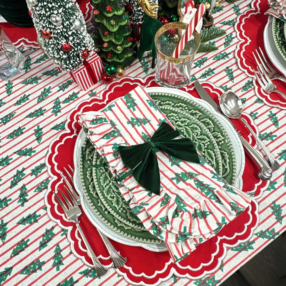 red stripe christmas tablecloth with christmas trees. Hand block printed. Red and green. with matching napkin and luxury placemat and velvet napkin bow. 