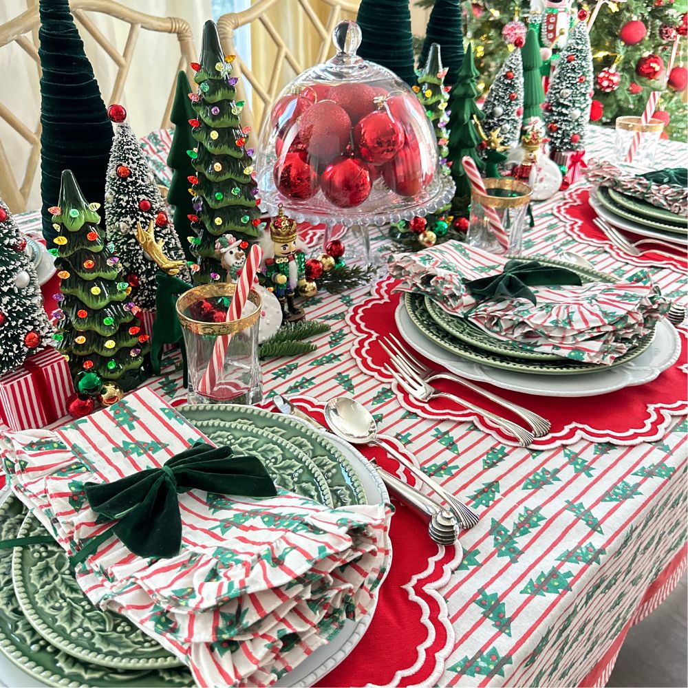red stripe christmas tablecloth with christmas trees. Hand block printed. Red and green. with matching napkin and luxury placemat and velvet napkin bow. 