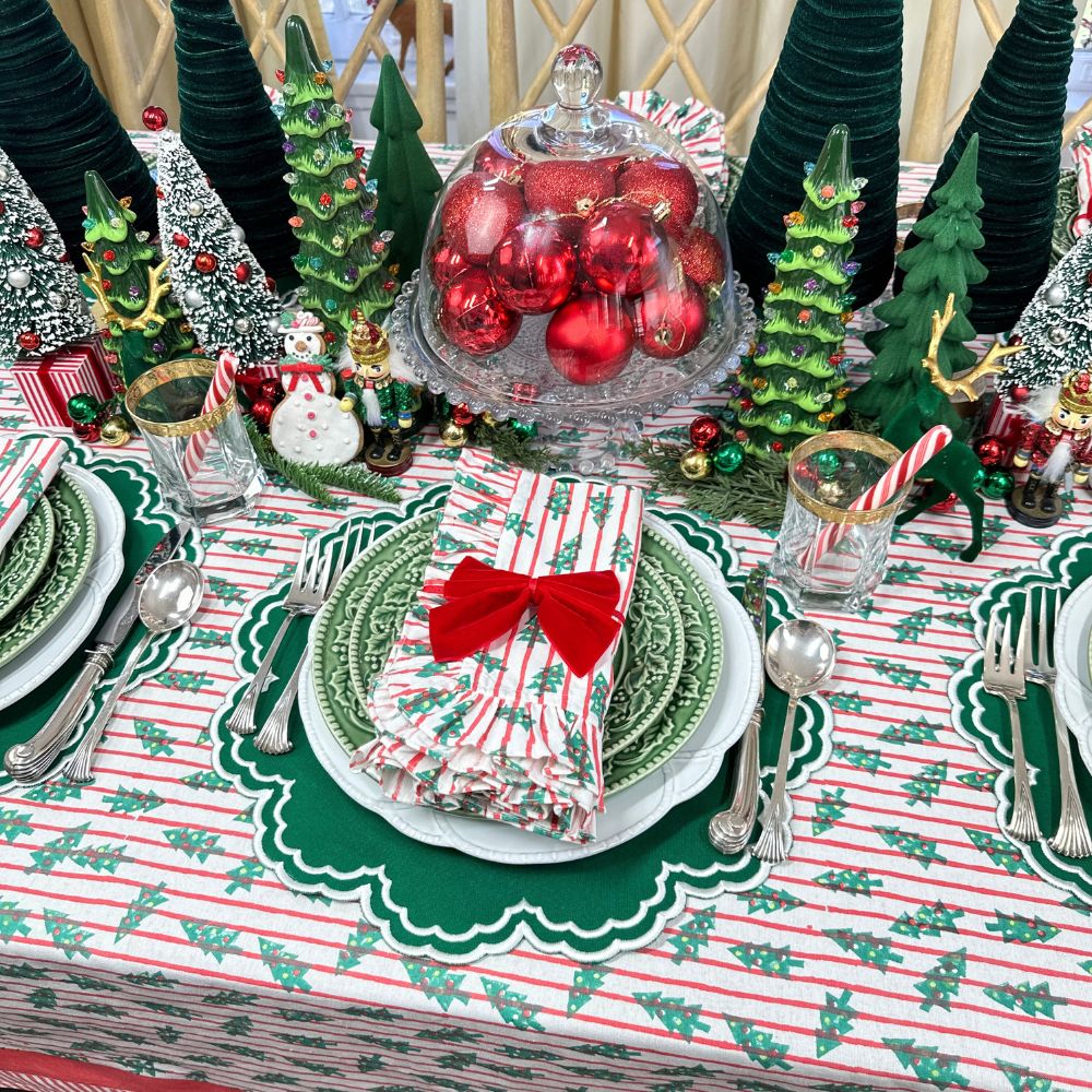 red stripe christmas tablecloth with christmas trees. Hand block printed. Red and green. with matching napkin and luxury placemat and velvet napkin bow. 