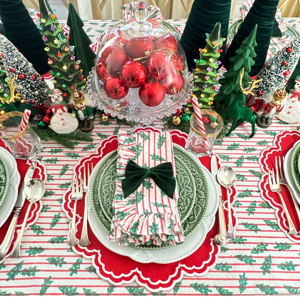 red stripe christmas tablecloth with christmas trees. Hand block printed. Red and green. with matching napkin and luxury placemat and velvet napkin bow. 
