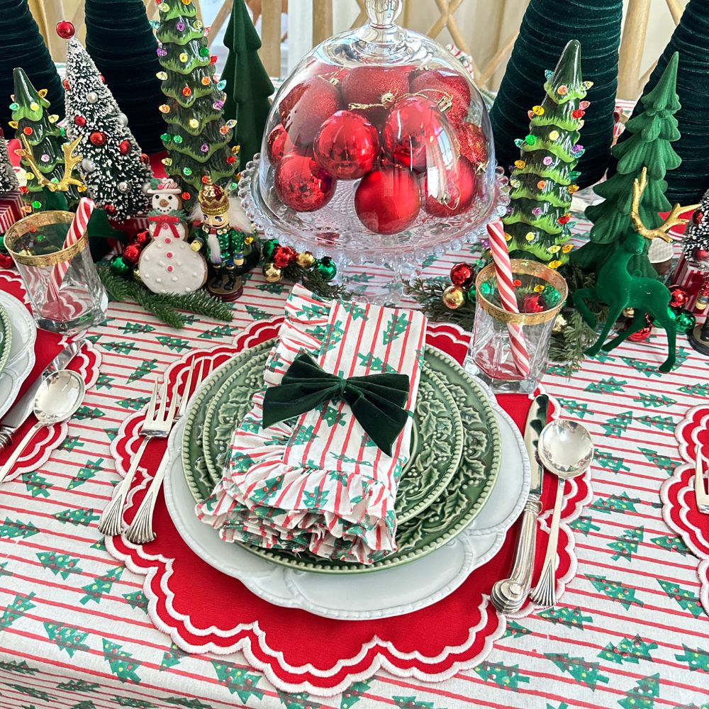 red stripe christmas tablecloth with christmas trees. Hand block printed. Red and green. with matching napkin and luxury placemat and velvet napkin bow. 