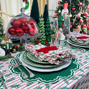 red stripe christmas tablecloth with christmas trees. Hand block printed. Red and green. with matching napkin and luxury placemat and velvet napkin bow. 