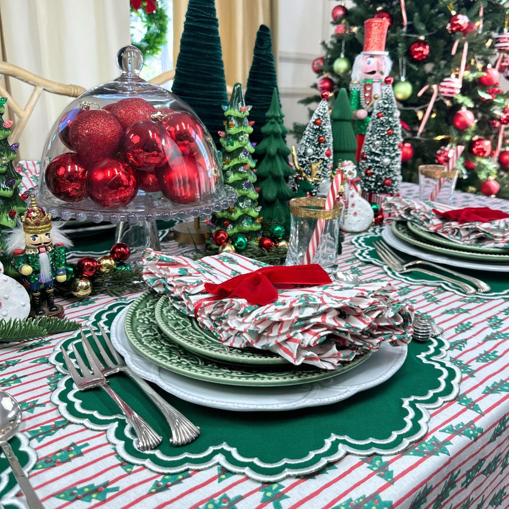 red stripe christmas tablecloth with christmas trees. Hand block printed. Red and green. with matching napkin and luxury placemat and velvet napkin bow. 