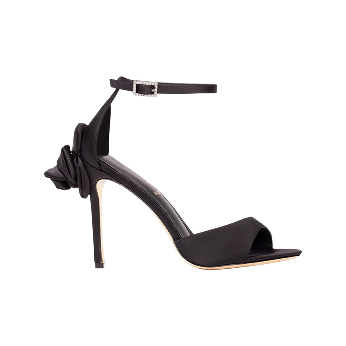 Side view of Josey 100 in Black Satin showcasing satin rosette detail and ankle strap against a white background