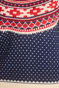 The Josie Sweater in St. Moritz Fair Isle has a ribbed crew neckline and long raglan sleeves.