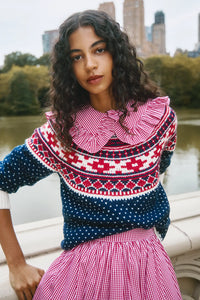 The Josie Sweater in St. Moritz Fair Isle has a ribbed crew neckline and long raglan sleeves.