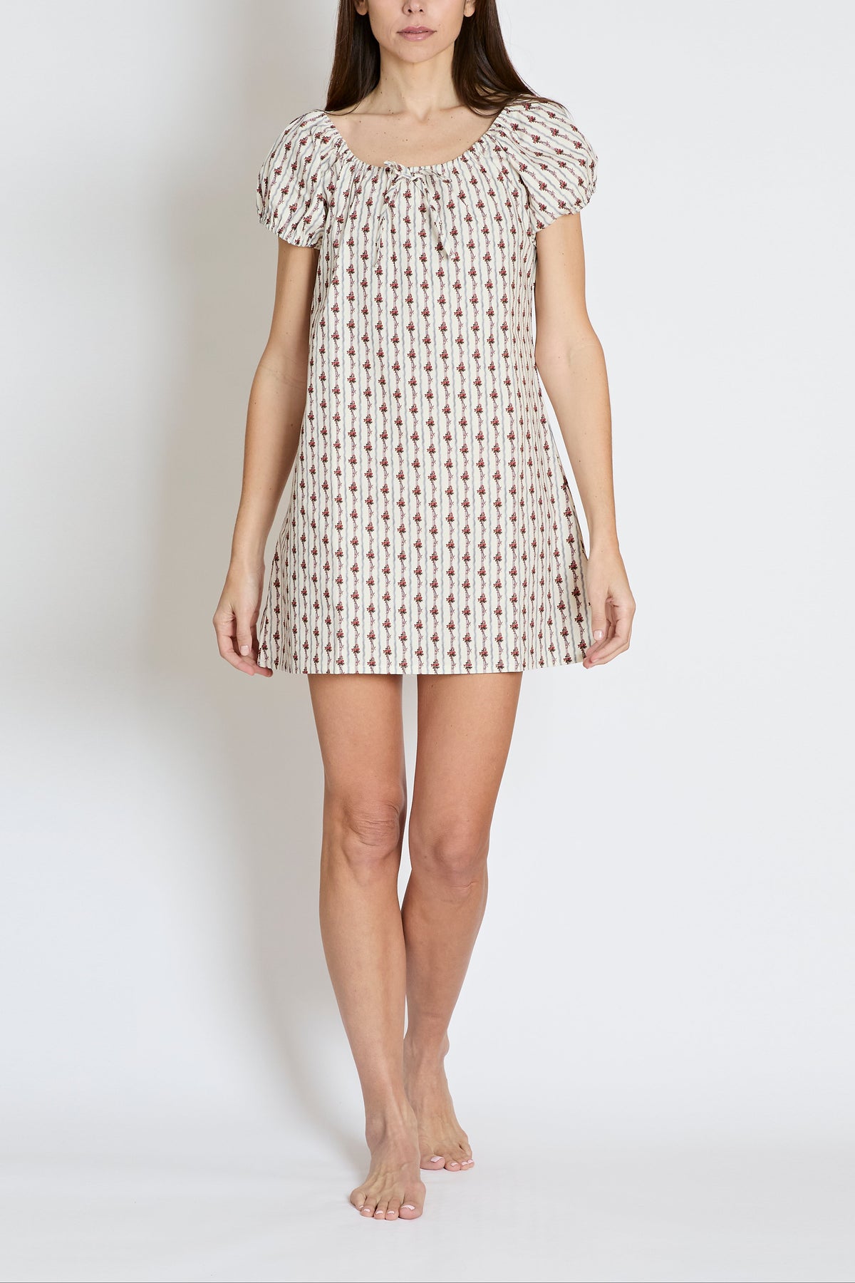 Front view of The Rose Garden Night Dress on model showing relaxed fit, puff sleeves, and red rose print on light background