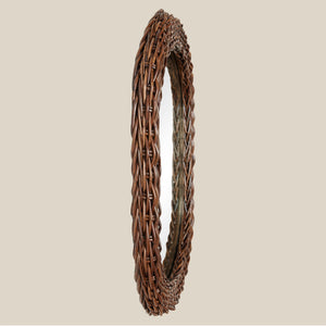 side view of brown rattan mirror